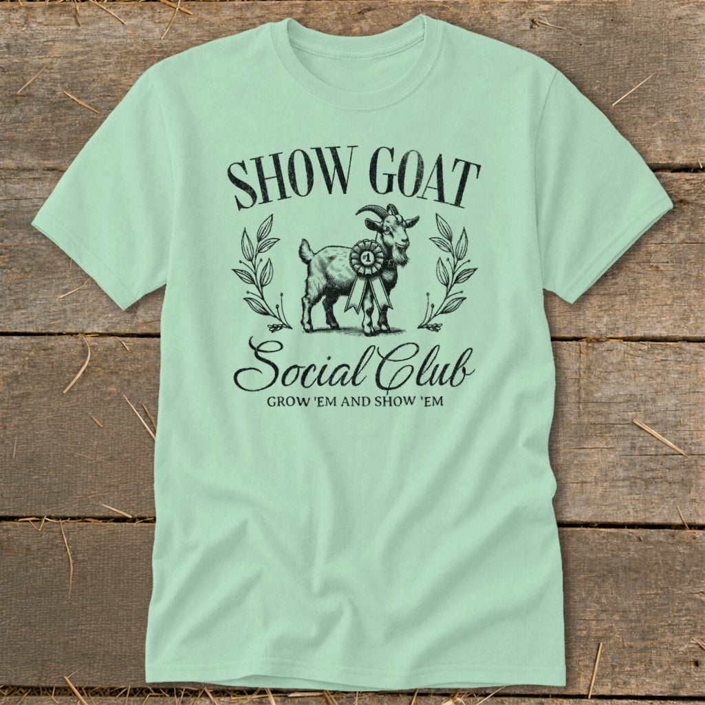 Light mint t-shirt with "SHOW GOAT Social Club" text and goat illustration.