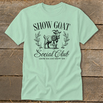Light mint t-shirt with "SHOW GOAT Social Club" text and goat illustration.