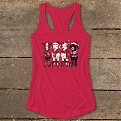Four goats in Christmas hats and scarves stand with gifts on a pink tank top.