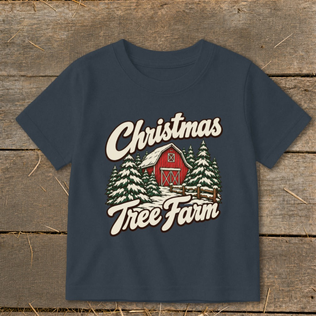Dark blue t-shirt with "Christmas Tree Farm" text over a red barn and snowy trees.
