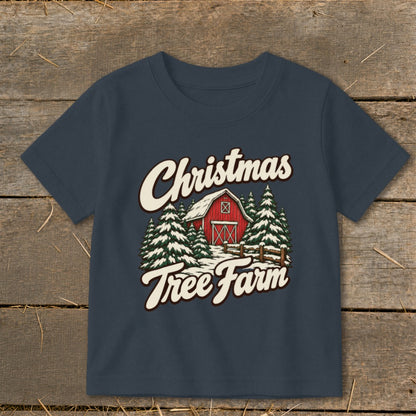 Dark blue t-shirt with "Christmas Tree Farm" text over a red barn and snowy trees.