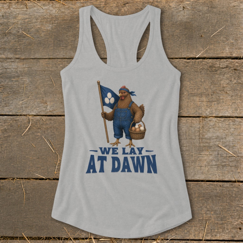 Tank top with a chicken in overalls holding a flag and basket of eggs, text reads "We Lay At Dawn".
