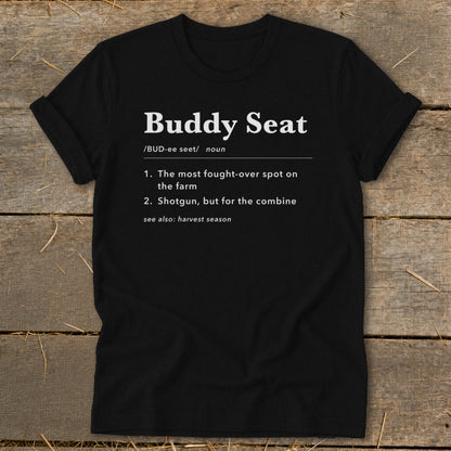 Black t-shirt with white text defining "Buddy Seat" with farm and combine references.