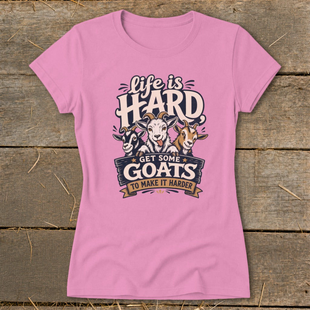 Pink t-shirt with graphic of three goats and text "Life is HARD GET SOME GOATS TO MAKE IT HARDER".
