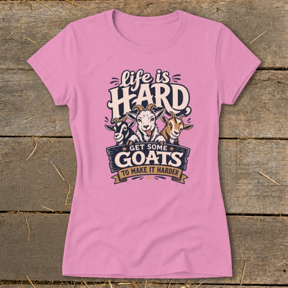 Pink t-shirt with graphic of three goats and text "Life is HARD GET SOME GOATS TO MAKE IT HARDER".