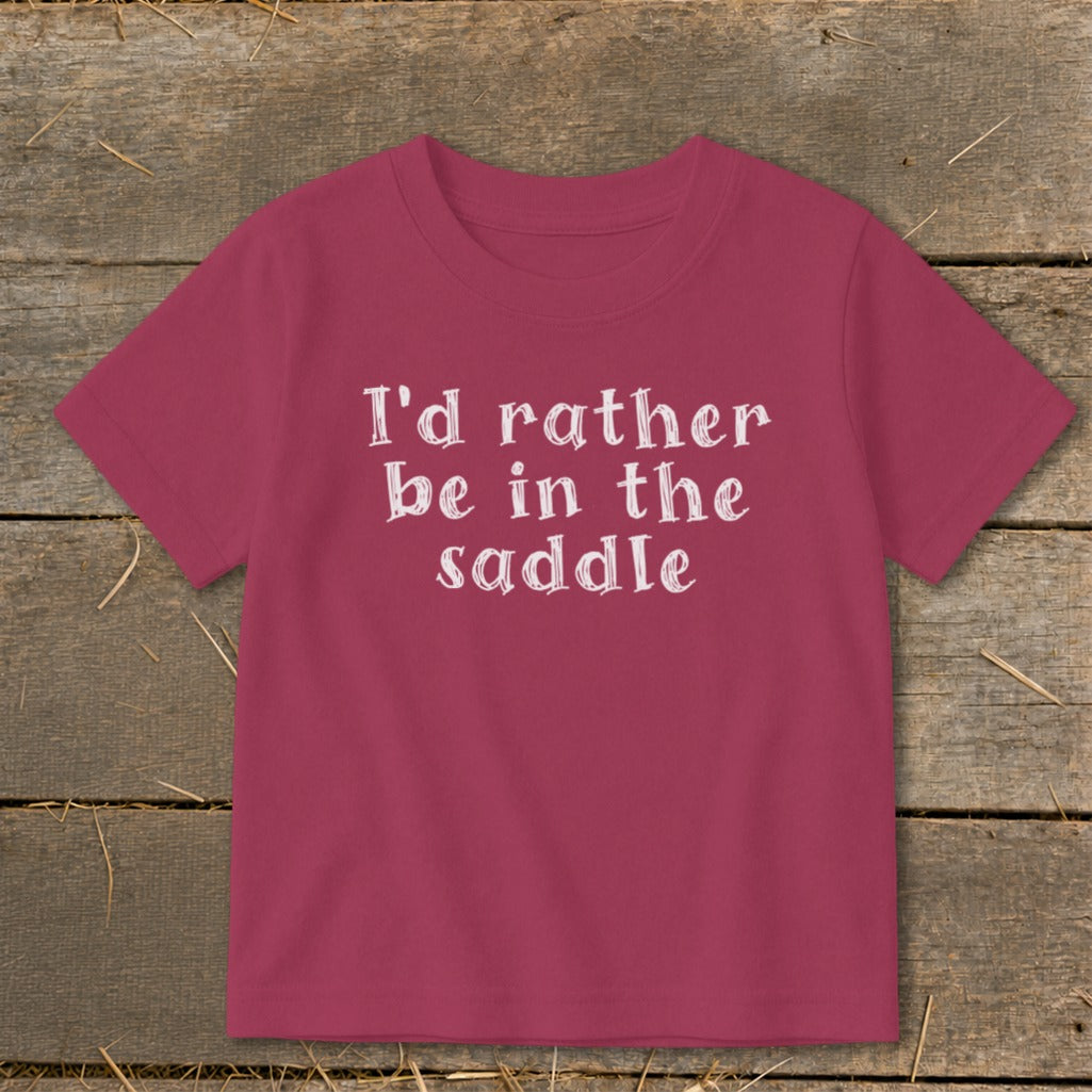 Maroon t-shirt with white text that reads "I'd rather be in the saddle."