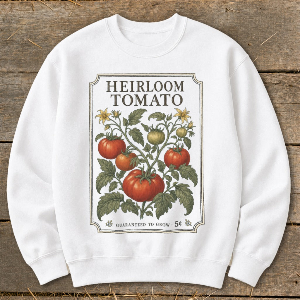 White sweatshirt with "Heirloom Tomato" design featuring a tomato vine with ripe tomatoes.