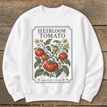 White sweatshirt with "Heirloom Tomato" design featuring a tomato vine with ripe tomatoes.