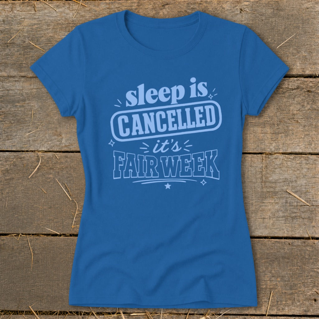 Blue t-shirt with text "sleep is CANCELLED it's FAIR WEEK".