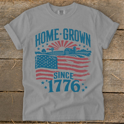 Gray t-shirt with "HOME GROWN SINCE 1776" and American flag farm graphic.
