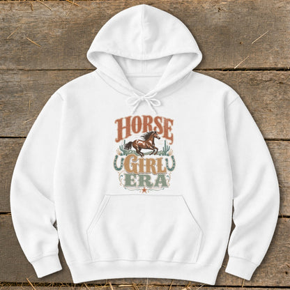 White hoodie with "Horse Girl Era" text and a running horse graphic.