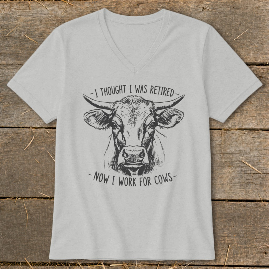 T-shirt with sketch of cow head and text "I THOUGHT I WAS RETIRED - NOW I WORK FOR COWS -".