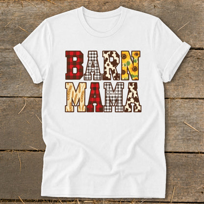 White t-shirt with "BARN MAMA" text in patchwork cow, buffalo plaid, and sunflower patterns.