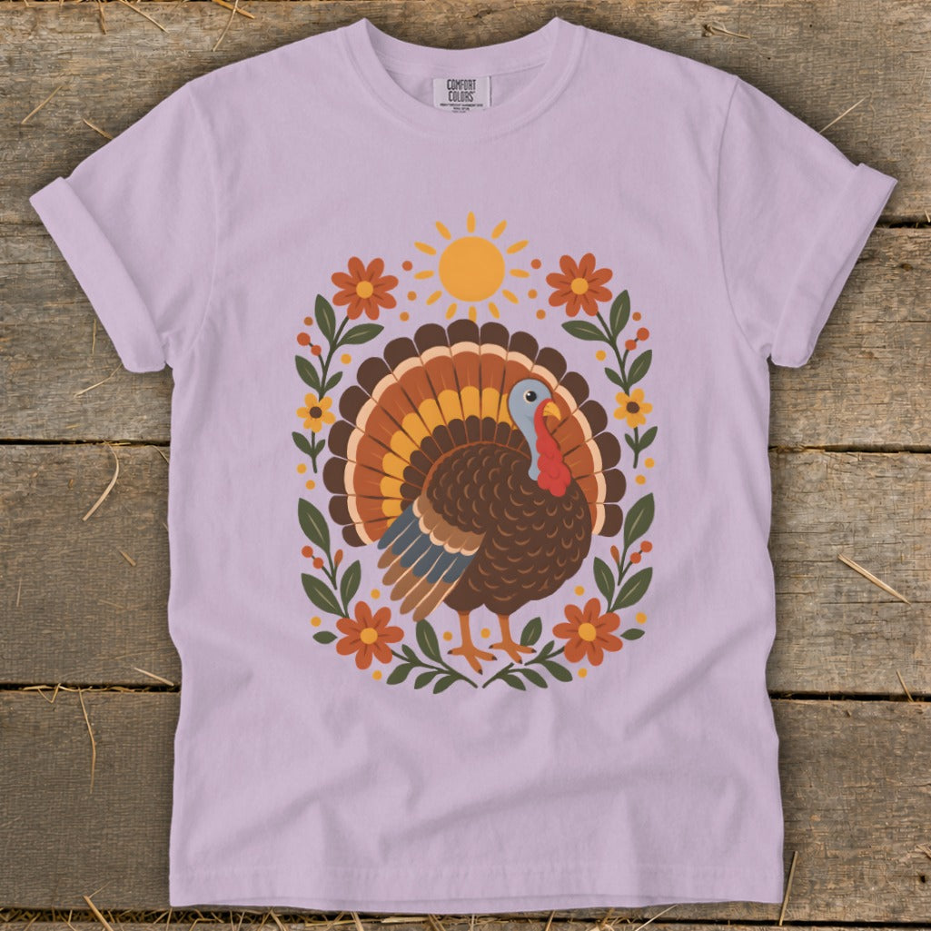 Light purple t-shirt with a brown turkey and floral sun design.