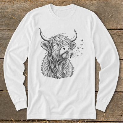 Long sleeve white shirt with a black sketch of a Highland cow blowing a dandelion.