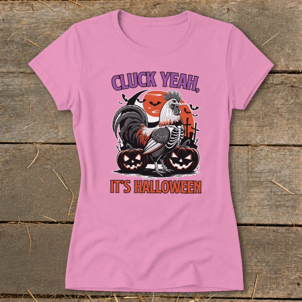 Pink t-shirt with skeleton rooster, pumpkins, bats, and text "Cluck Yeah, It's Halloween".