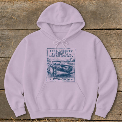 Lilac hoodie with "Life, Liberty and the Pursuit of a Good Nap in the Truck" graphic.