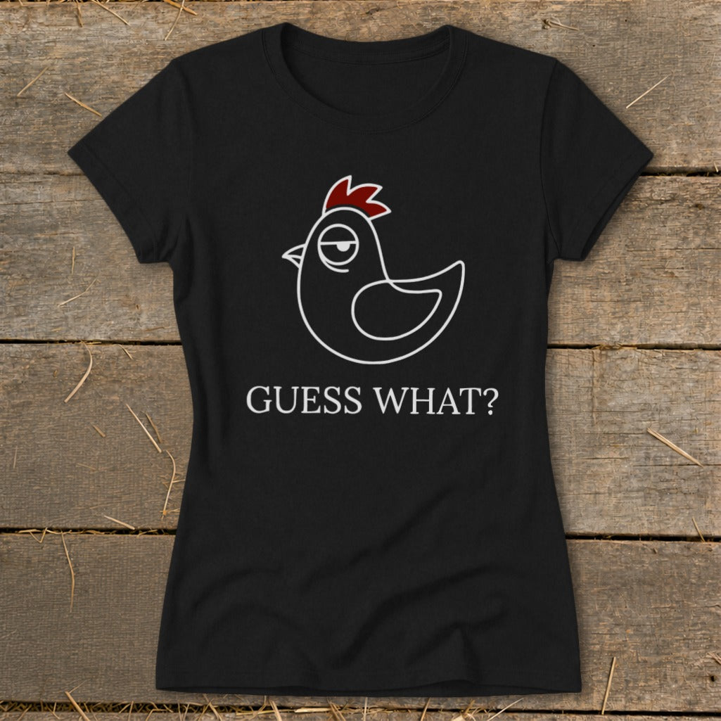 Black t-shirt with a cartoon chicken graphic and text "GUESS WHAT?".
