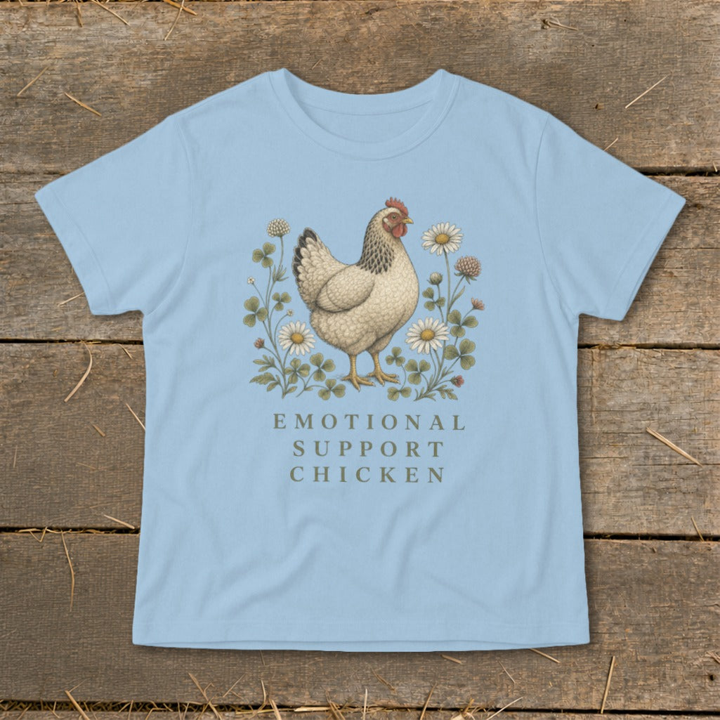 Light blue t-shirt with a chicken illustration surrounded by flowers and text "EMOTIONAL SUPPORT CHICKEN".