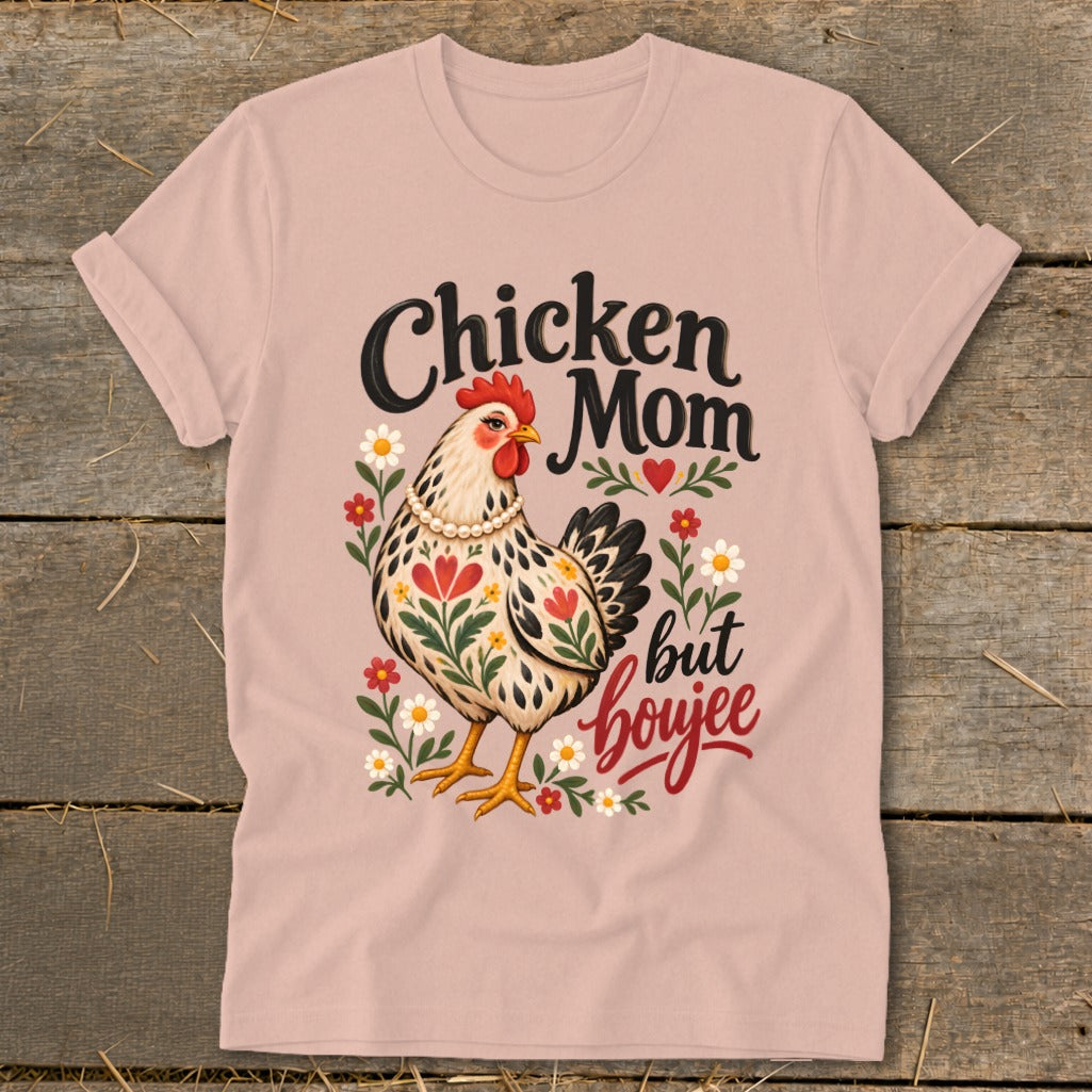 Chicken Mom but boujee graphic on a pink t-shirt with a hen and flowers.