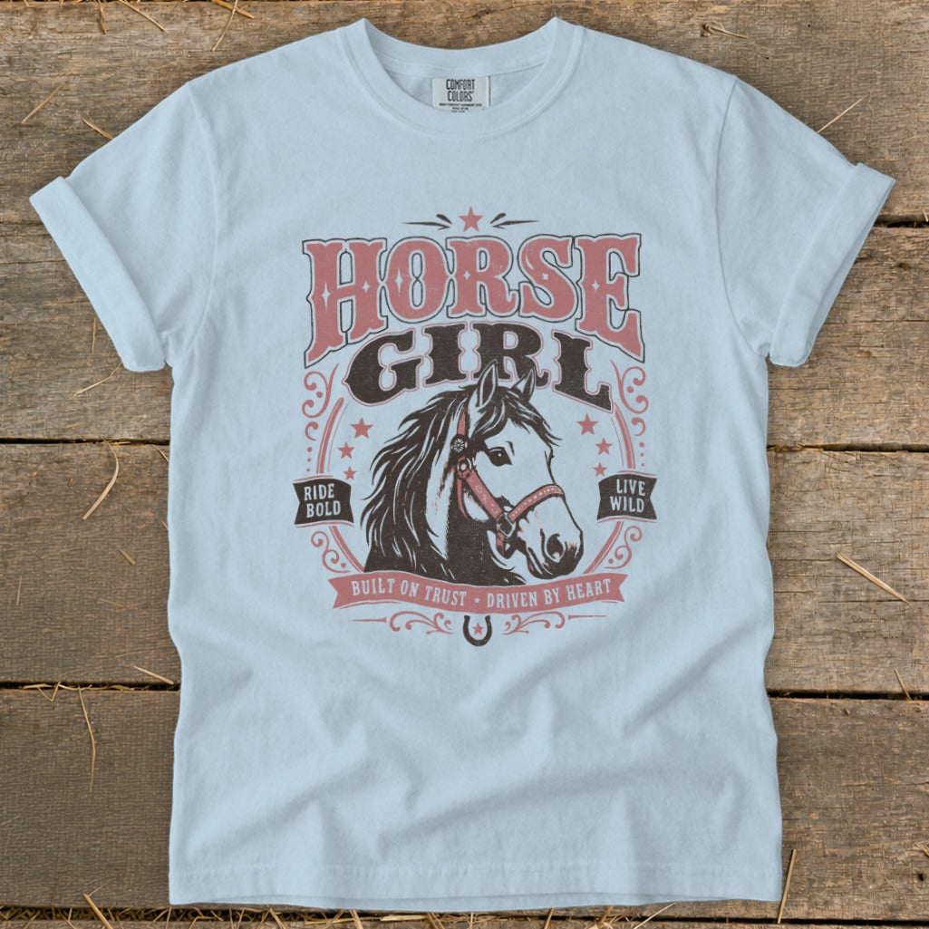 Light blue t-shirt with "HORSE GIRL" and horse graphic, "Ride Bold Live Wild."