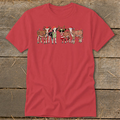 Red t-shirt with cartoon cows wearing Santa hats and Christmas lights.