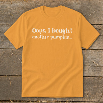 Orange t-shirt with white text reading "Oops, I bought another pumpkin..."