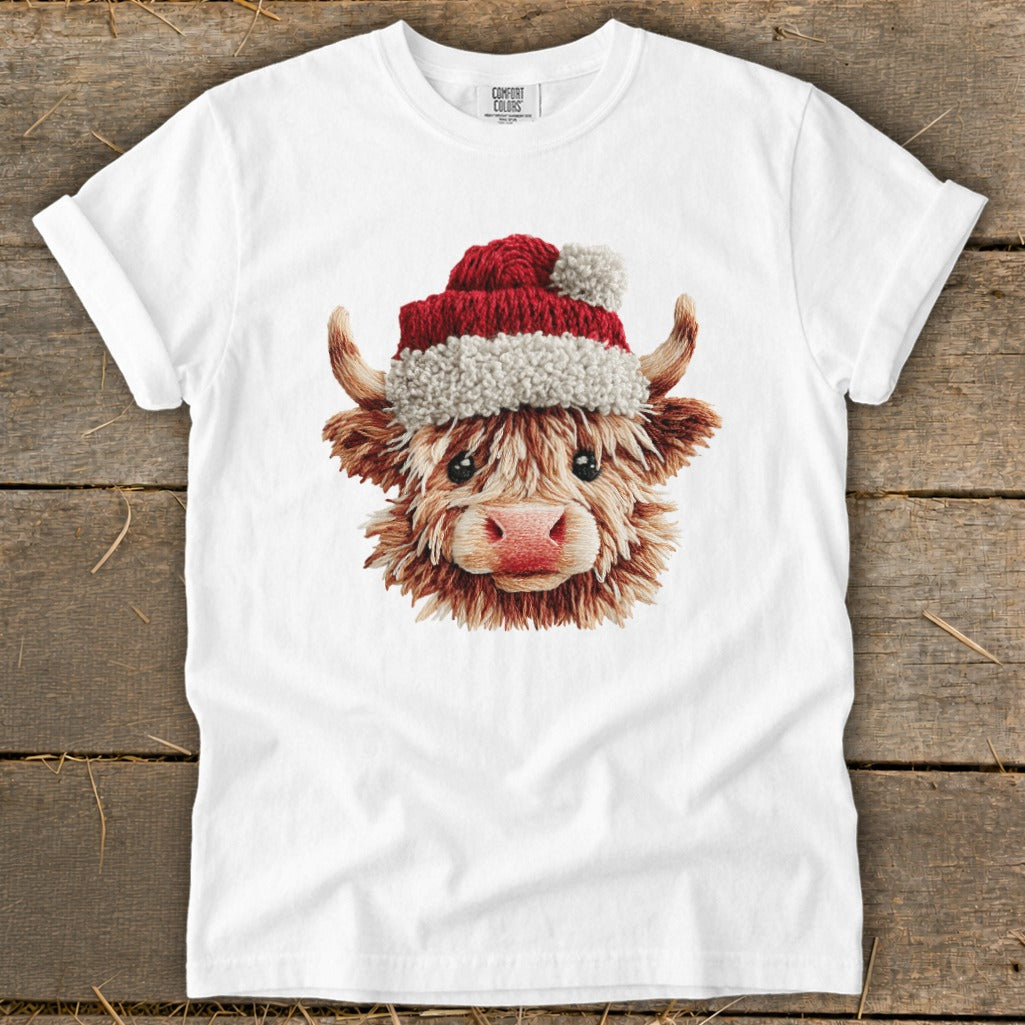 White t-shirt with embroidered Highland cow wearing a Santa hat.