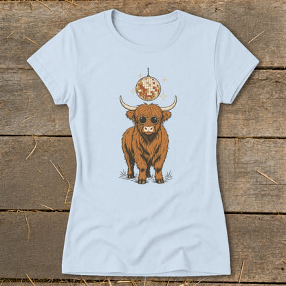 Highland cow wearing sunglasses with a disco ball above on a light blue t-shirt.