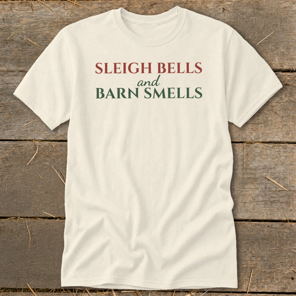 Cream t-shirt with red and green text reading "Sleigh Bells and Barn Smells".