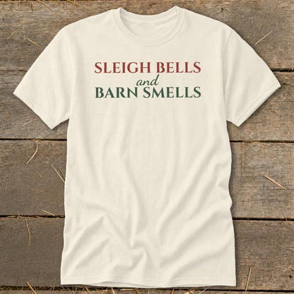Cream t-shirt with red and green text reading "Sleigh Bells and Barn Smells".