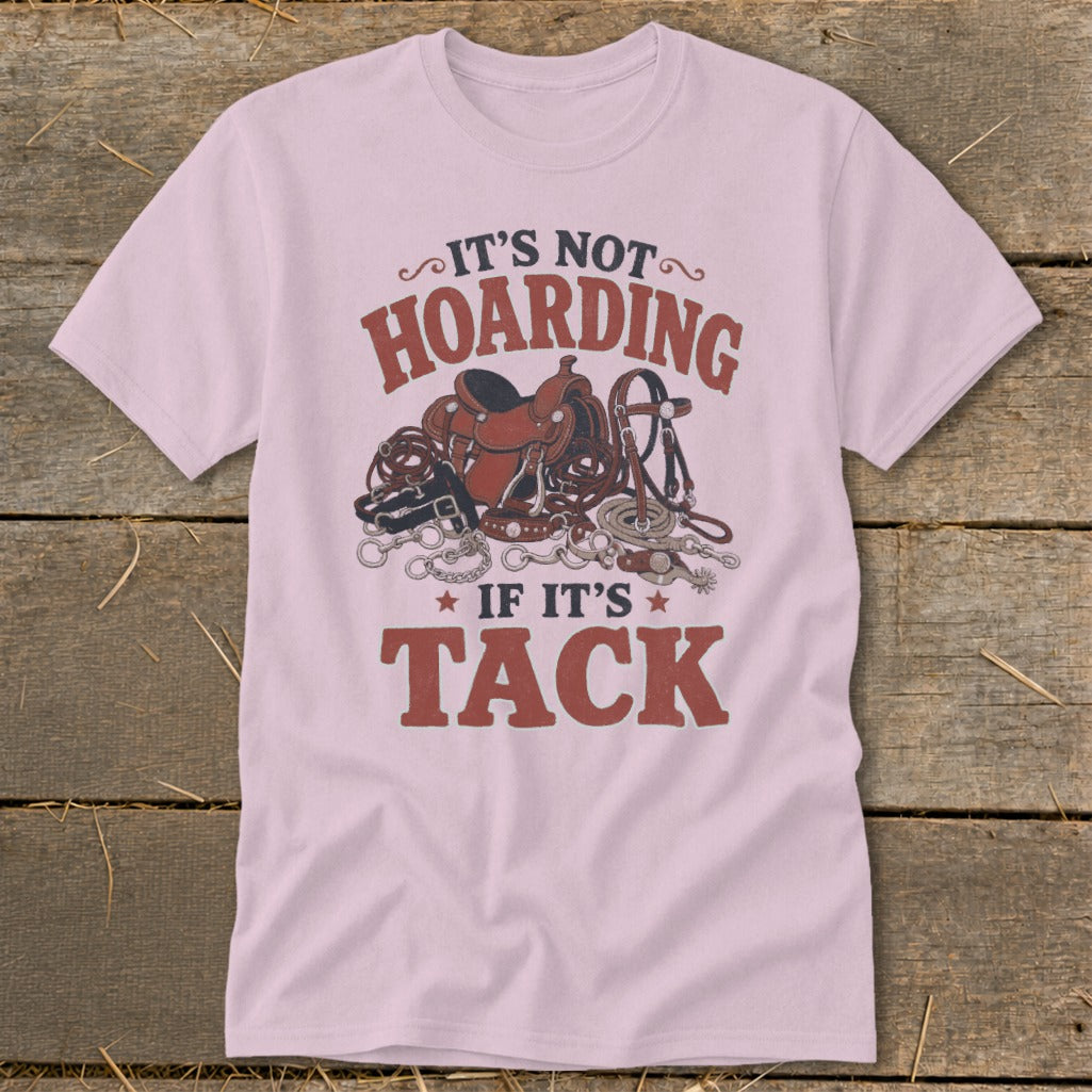 Light pink t-shirt with "IT'S NOT HOARDING IF IT'S TACK" and horse tack graphic.