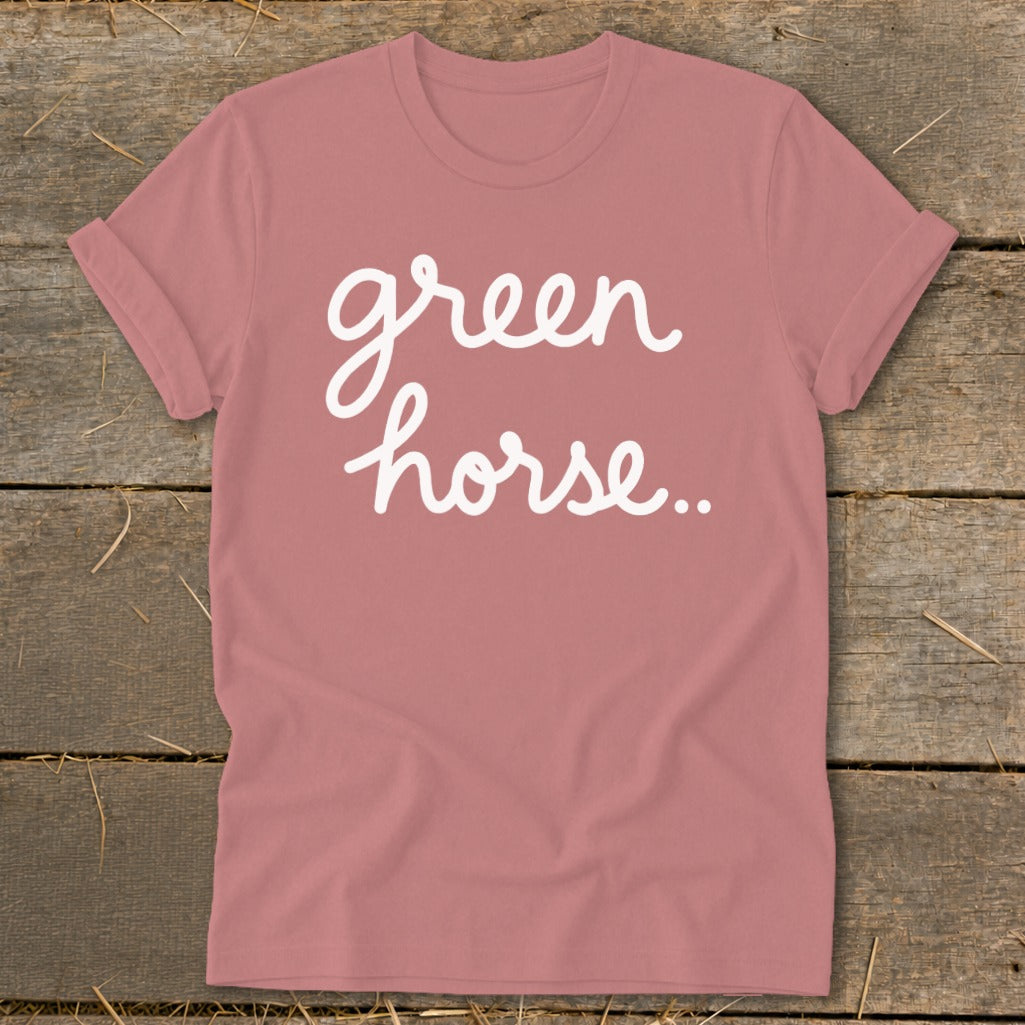 Rose-colored t-shirt with white cursive text that says "green horse.."
