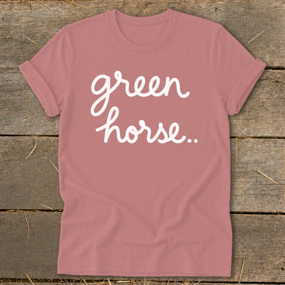 Rose-colored t-shirt with white cursive text that says "green horse.."
