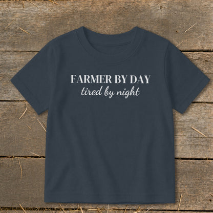 Navy t-shirt with white text reading "FARMER BY DAY tired by night".