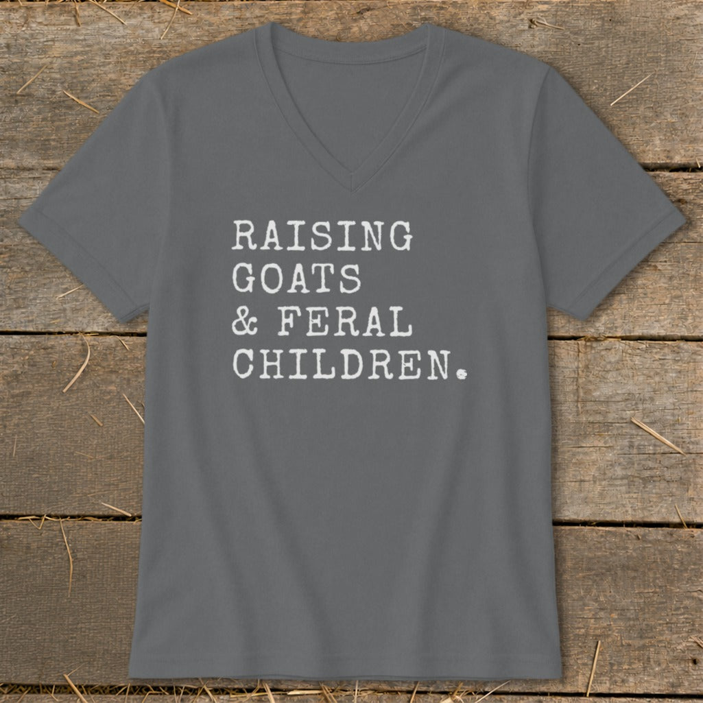 Gray v-neck t-shirt with white text reading "RAISING GOATS & FERAL CHILDREN."