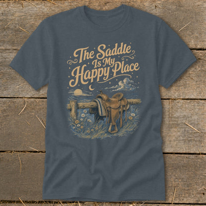 T-shirt graphic with saddle on fence and text "The Saddle Is My Happy Place".