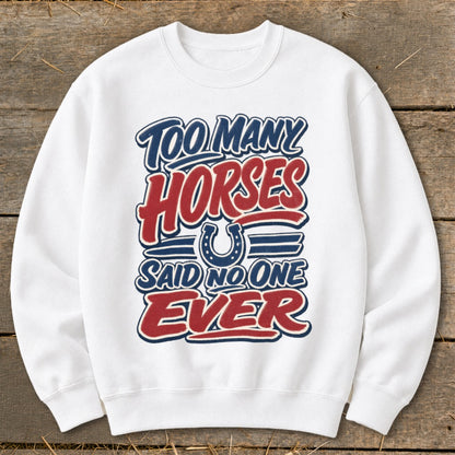 White sweatshirt with "Too Many Horses Said No One Ever" graphic and horseshoe.