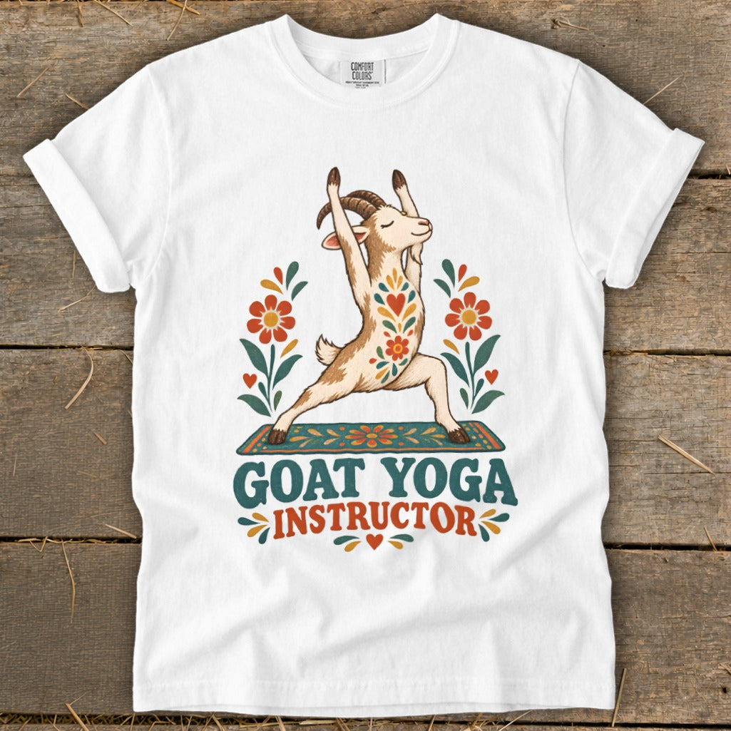White t-shirt with a goat in a yoga pose, surrounded by flowers, and text reading "GOAT YOGA INSTRUCTOR".