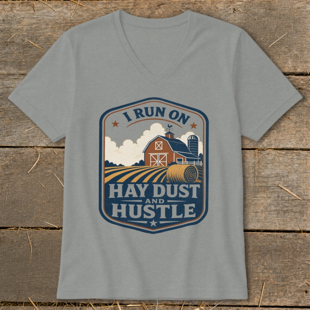 Grey t-shirt with a farm scene graphic and text that reads "I Run On Hay Dust And Hustle."