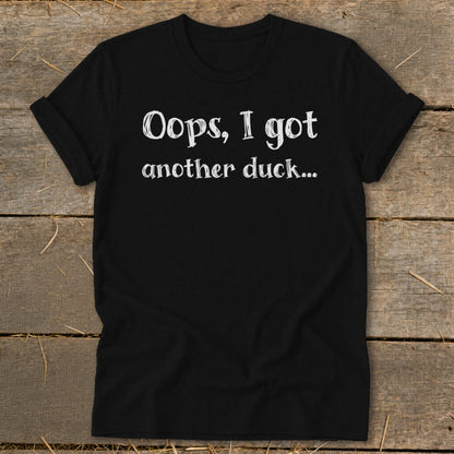 Black t-shirt with white text reading "Oops, I got another duck...".