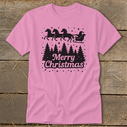 Pink t-shirt with black Christmas trees, Santa in a sleigh pulled by horses, and "Merry Christmas" text.