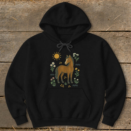 Black hoodie with a brown horse, sun, and floral illustration.