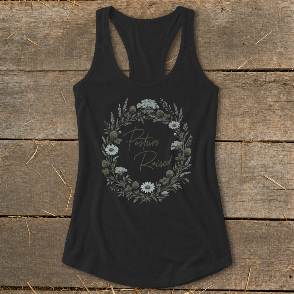 Black tank top with floral wreath graphic and "Pasture Raised" text.