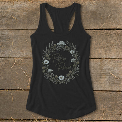 Black tank top with floral wreath graphic and "Pasture Raised" text.