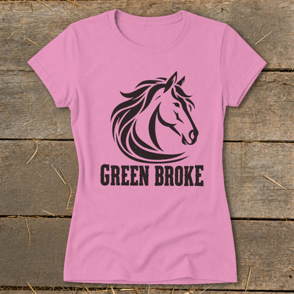 Pink women's t-shirt featuring a black horse head graphic and the text "GREEN BROKE".