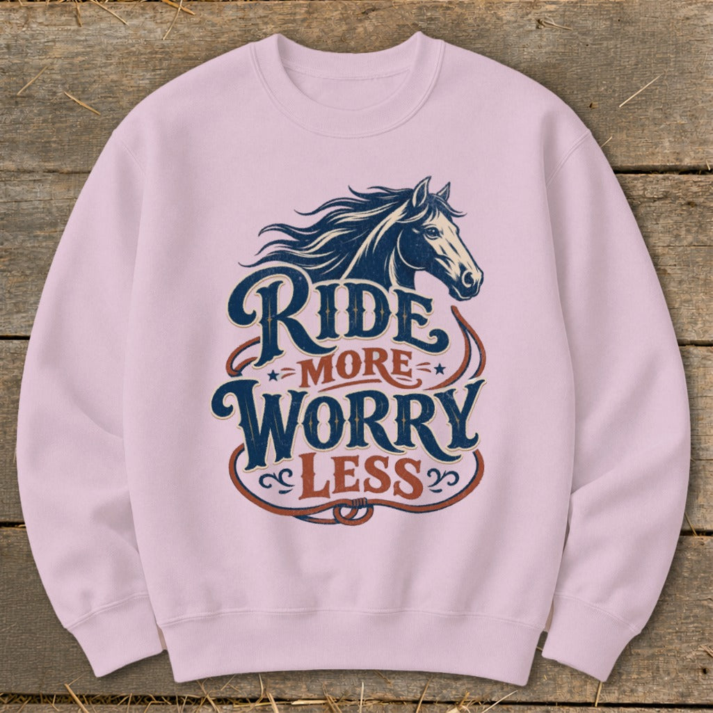 Pink crewneck sweatshirt with a horse graphic and "Ride More Worry Less" text.