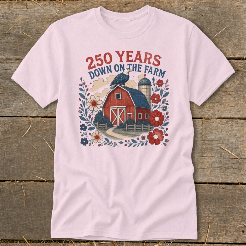 Pink t-shirt with 250 Years Down on the Farm graphic featuring barn, eagle, and flowers.