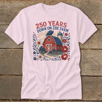 Pink t-shirt with 250 Years Down on the Farm graphic featuring barn, eagle, and flowers.
