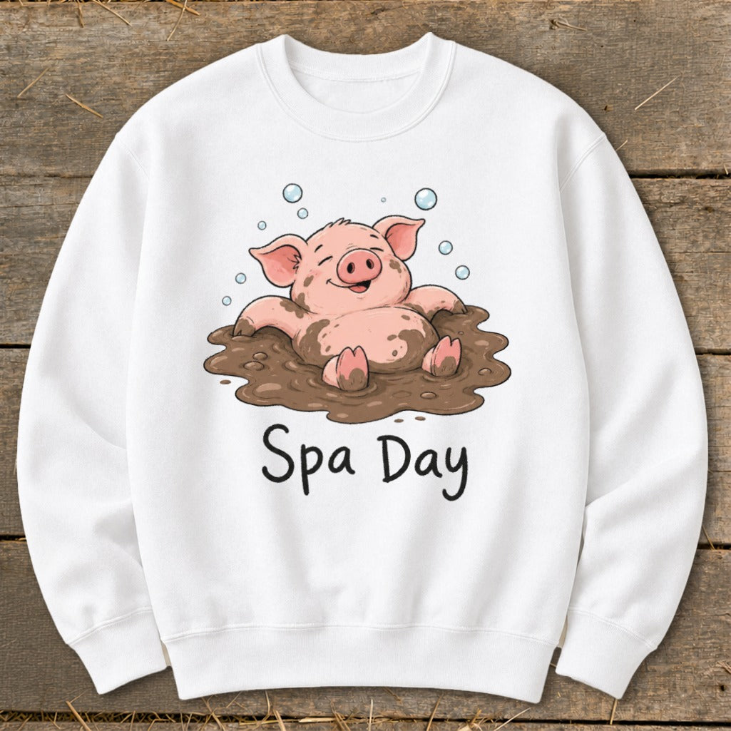 White sweatshirt with cartoon pig in mud labeled "Spa Day".